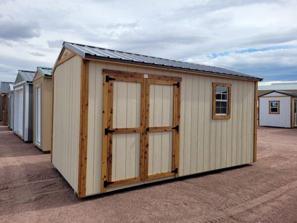 Front view double doors gable shed tan walls with window