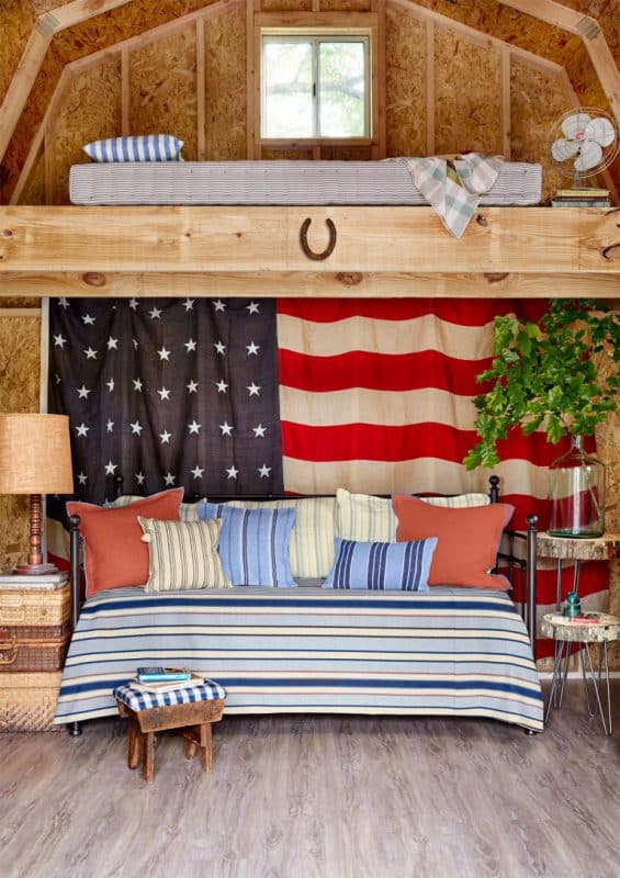 Using a loft in a high barn style storage shed as a bed.
