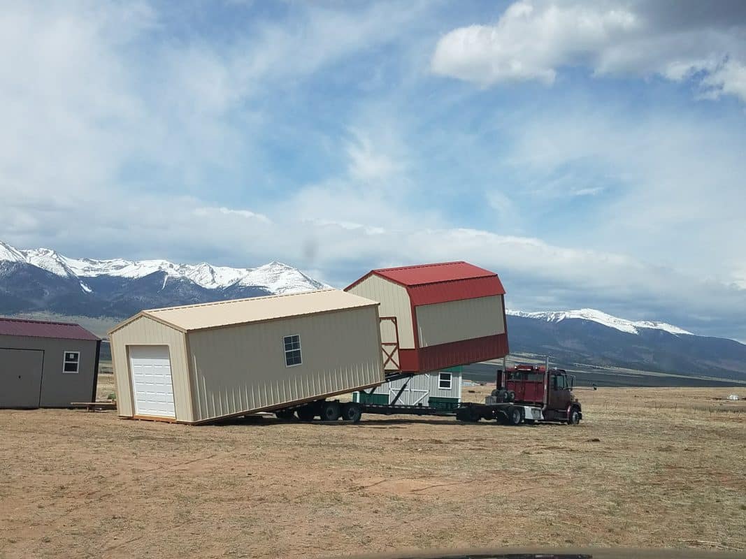 A storage shed being delivered.