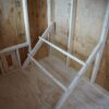 Chicken Coop 6x8 perfect for raising chickens, viewed from the inside, showing the roosting perches already installed.