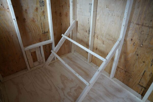 Chicken Coop 6x8 perfect for raising chickens, viewed from the inside, showing the roosting perches already installed.