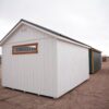 A view of the side of a 12x16 Studio Gable storage shed.