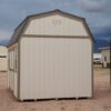 10x16 Barn Style storage shed with double doors and two windows viewed from the side.