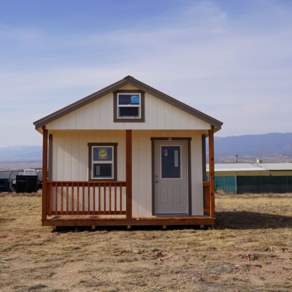 Gable storage shed w/ Porch 14x32 prepared for a more residential use, viewed from the front, highlighting the door, porch, and two windows