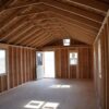 Interior view of the Gable storage shed w/ Porch 14x32 prepared for a more residential use. The interior still has not been finished.