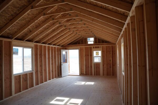 Interior view of the Gable storage shed w/ Porch 14x32 prepared for a more residential use. The interior still has not been finished.