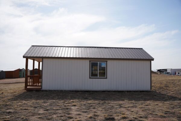 Gable storage shed w/ Porch 14x32 prepared for a more residential use, viewed from the right side.