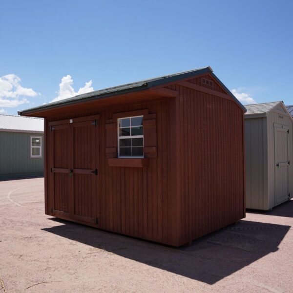 Tackroom Style 8x12 storage shed with wood siding, double doors, and a window.