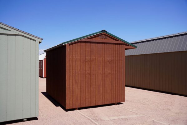 Tackroom Style 8x12 storage shed with wood siding viewed from the left back corner.