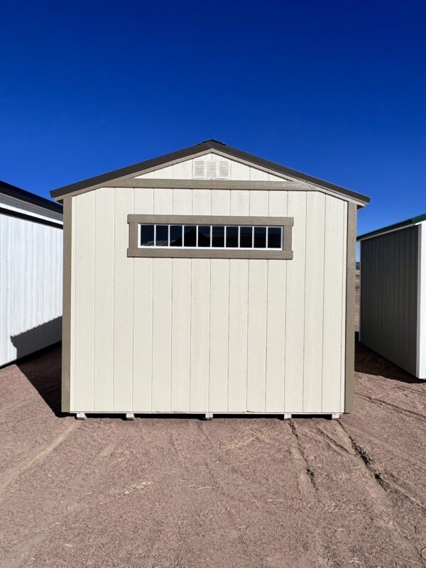 Spacious 10x16 Gable Style shed showcasing elegant tan wooden walls from the rear view. Perfect storage solution with ample room and timeless aesthetics.