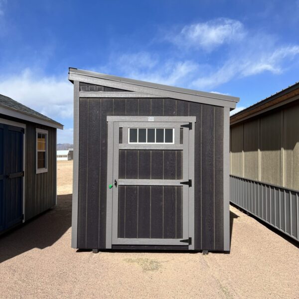 Discover our modern 8x12 Urban Style storage shed, featuring a sleek grey door and an eye-catching angled roof, perfectly blending functionality with contemporary design.
