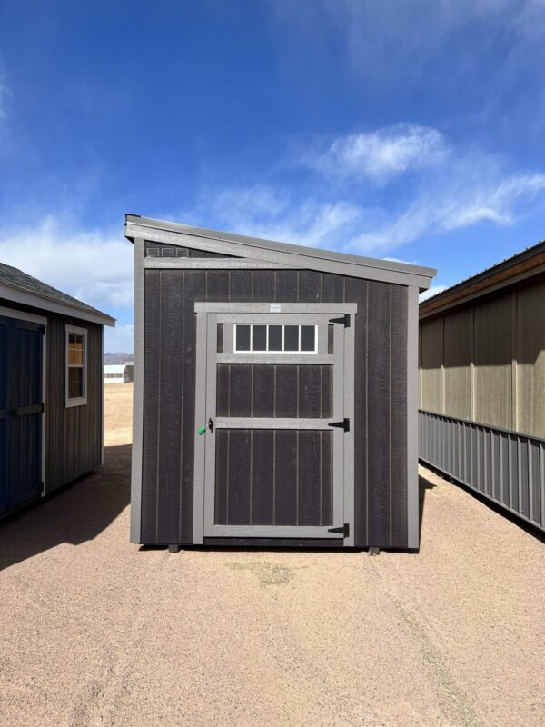 Discover our modern 8x12 Urban Style storage shed, featuring a sleek grey door and an eye-catching angled roof, perfectly blending functionality with contemporary design.