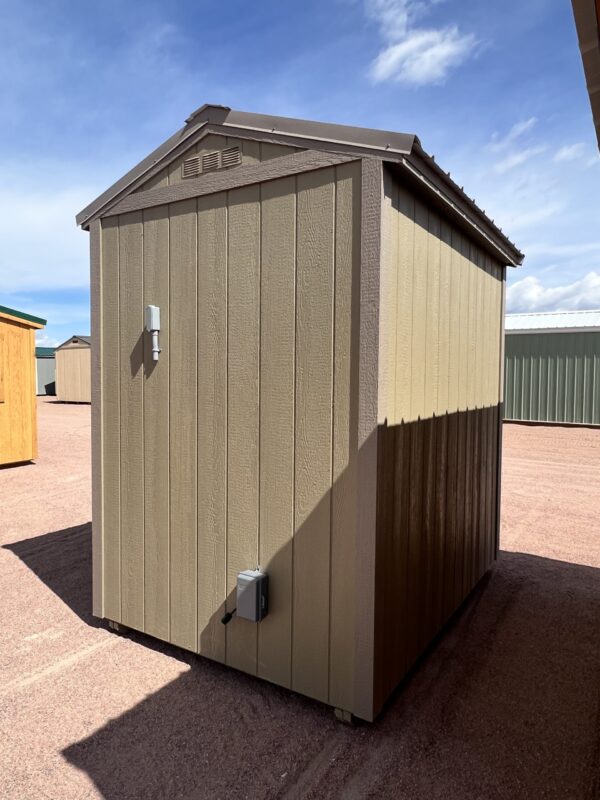 A view of the side of a beige 6x8 Gable Style storage shed with Interior Finish.