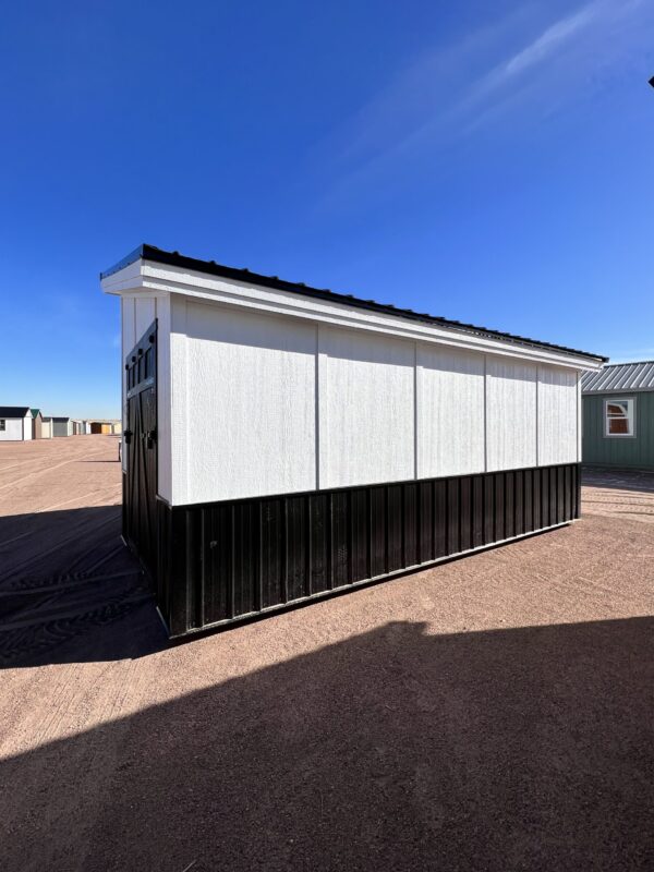 Experience the grandeur of the 10x20 Royal Gorge Style storage shed, boasting a striking combination of white walls, black trim, and roof. This expansive shed provides ample space for all your storage needs, while its elegant design adds a touch of sophistication to your property.