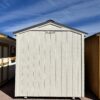 Discover the spaciousness of our 8x14 Gable Style storage shed as you view it from the back, showcasing its wide design and light grey wooden paneling. This versatile shed offers ample room for all your storage needs while exuding a contemporary and stylish appeal that seamlessly integrates with your outdoor space.