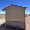 8x12 Tackroom Style storage shed, viewed from the right side.