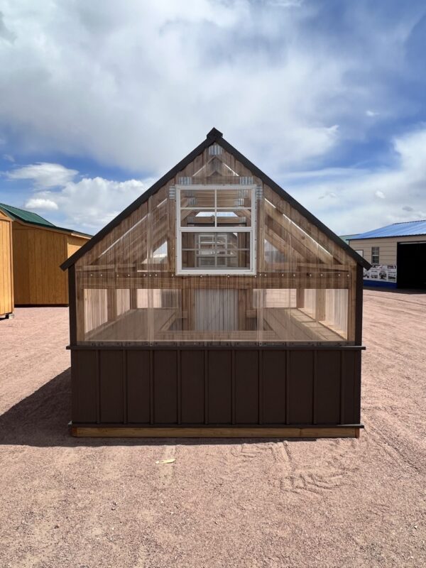 A cloud-filled sky frames the 8x8 Greenhouse shown from the back.