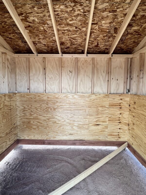 Step into the interior of our 8x10 Loafing storage shed and embrace the endless possibilities for customization with its unfinished wooden interior. This blank canvas allows you to personalize the space according to your unique preferences and storage requirements, creating a truly tailored storage solution.