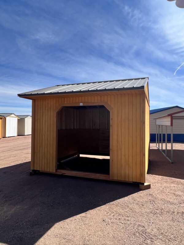 Capture the front view of our 12x12 Loafing shed, featuring a spacious opening without doors, designed for effortless accessibility. The absence of doors creates a wide and inviting entrance, allowing for easy entry and convenient storage of your items.