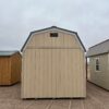 The sky is dotted with clouds as a wooden shed stands in the outdoor property, its door invitingly open.
