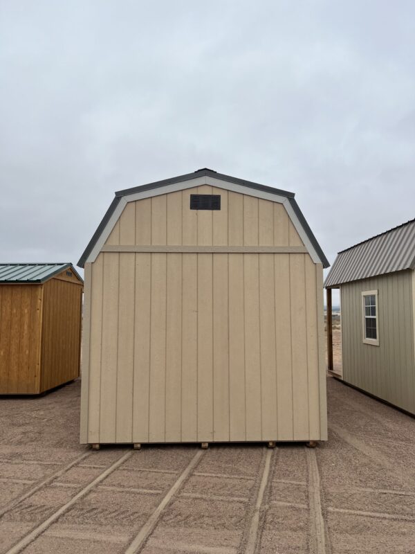 The sky is dotted with clouds as a wooden shed stands in the outdoor property, its door invitingly open.