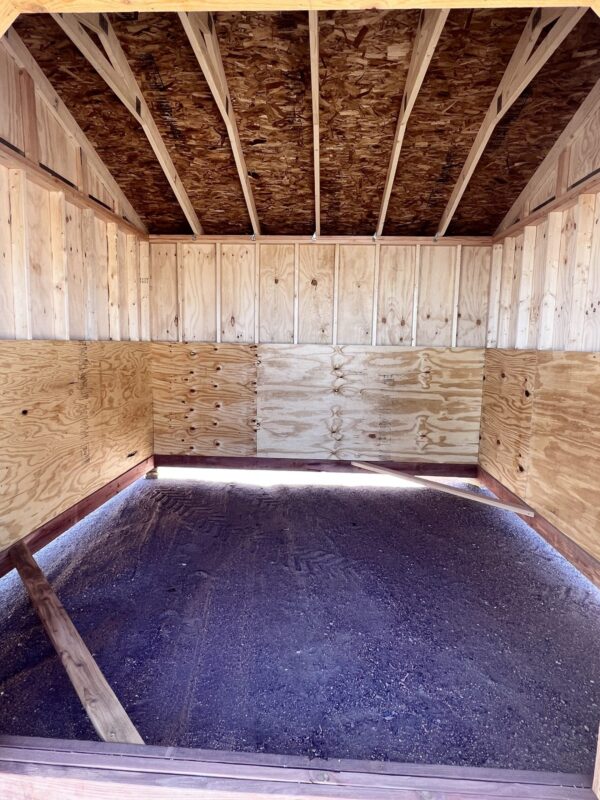 Step inside our 12x12 Loafing shed to discover a charming wooden interior that exudes warmth and rustic appeal. This natural and inviting space offers a cozy environment for storing and organizing your belongings with a touch of traditional elegance.