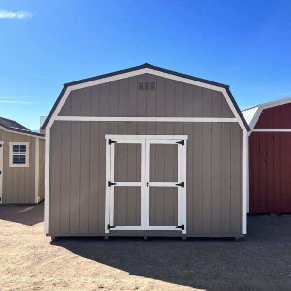 Face the front of our 14x32 Barn Style storage shed head-on and behold the striking presence of the double doors that greet you. This direct view showcases the grand entrance of the shed, emphasizing its impressive size and providing easy access to the expansive interior.