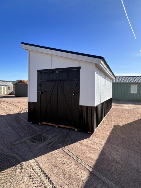 Frontal view showcasing the 10x20 Royal Gorge Style storage shed with striking black double doors. A perfect blend of functionality and aesthetics, offering generous storage capacity and easy accessibility in a sleek and stylish design.