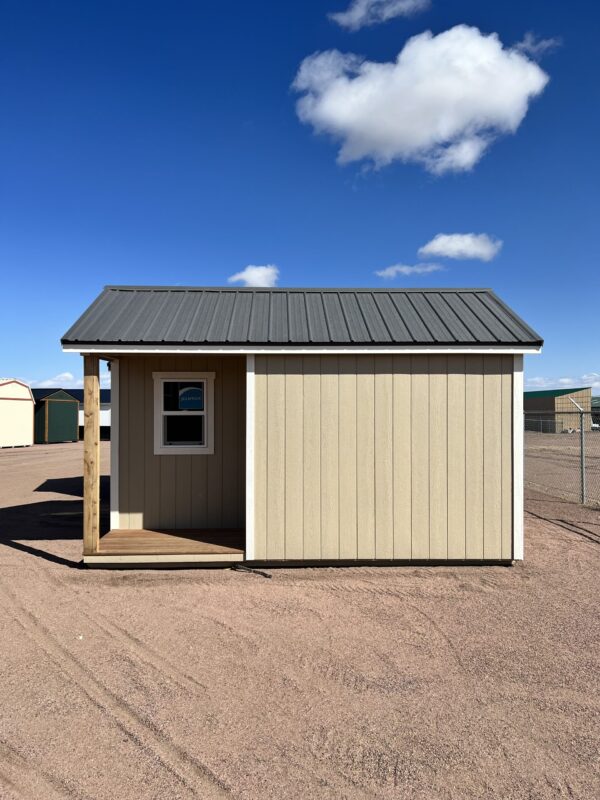 Experience the inviting front view of our 10x16 Gable storage shed, revealing a small porch that adds a charming touch to its design. Complete with a window on the porch, this shed seamlessly blends practicality and aesthetics, offering a functional storage solution with a cozy outdoor space.