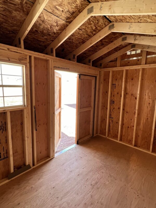 Interior view of the 8x12 Tackroom Style storage shed, facing out of the double doors.