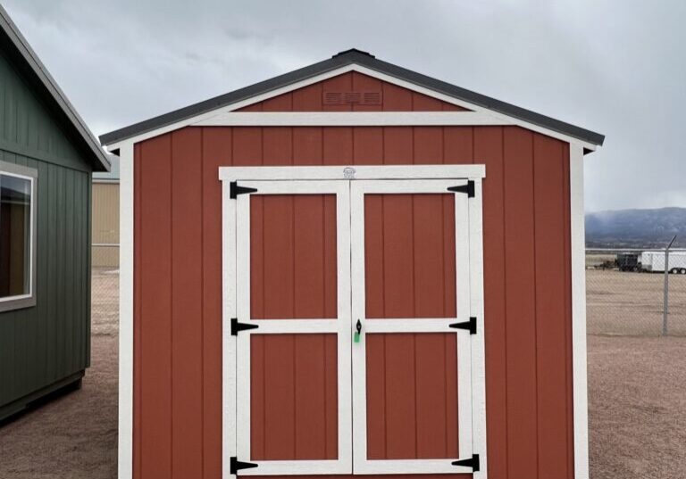 Gable Style 10x16 storage shed with double swinging doors. Red walls and white trim