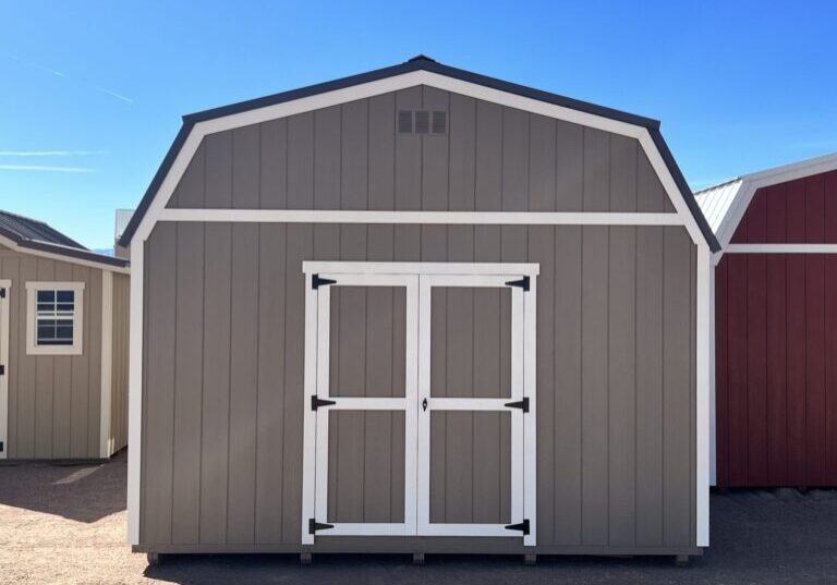 Face the front of our 14x32 Barn Style storage shed head-on and behold the striking presence of the double doors that greet you. This direct view showcases the grand entrance of the shed, emphasizing its impressive size and providing easy access to the expansive interior.